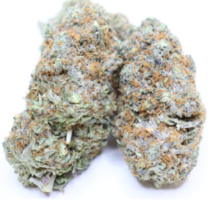 Mango Pineapple Haze premium cannabis flower with frosty trichomes and tropical fruit aroma